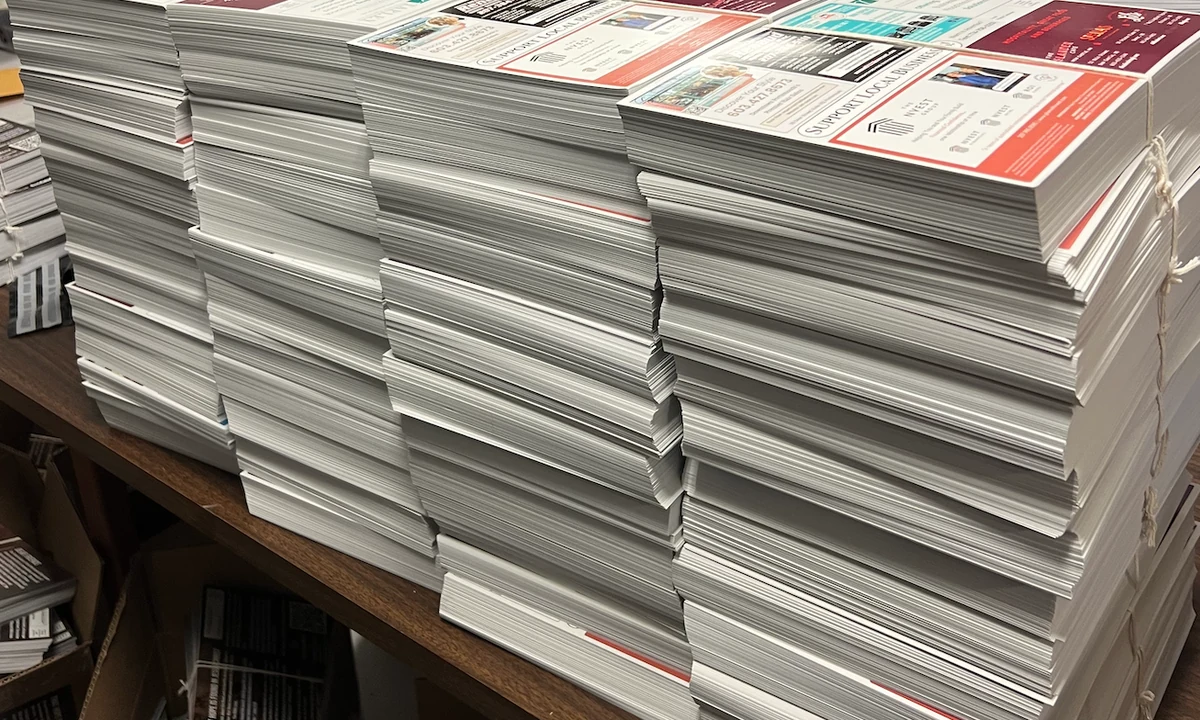 Printed shared advertising postcards ready to be bundled